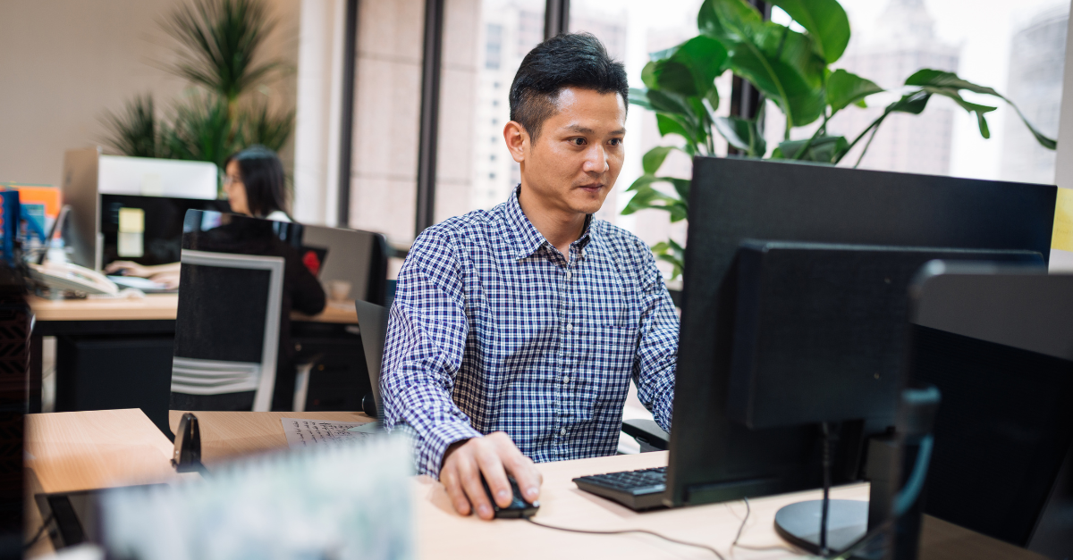 Asian man using computer