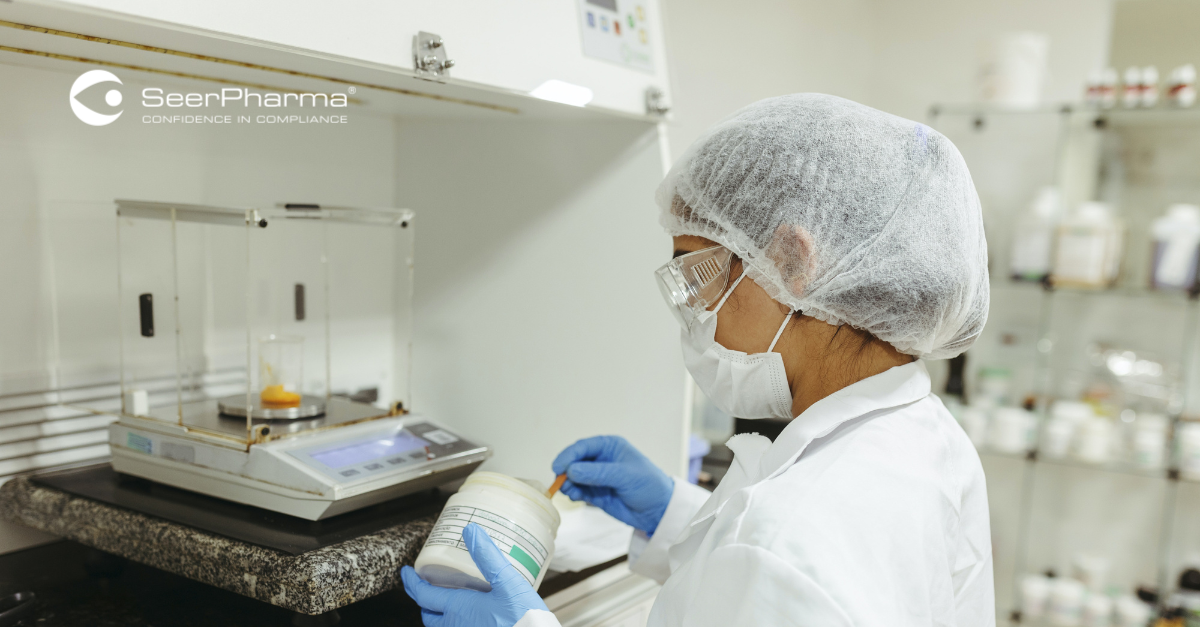GMP Laboratory Scientist working in a fume hood
