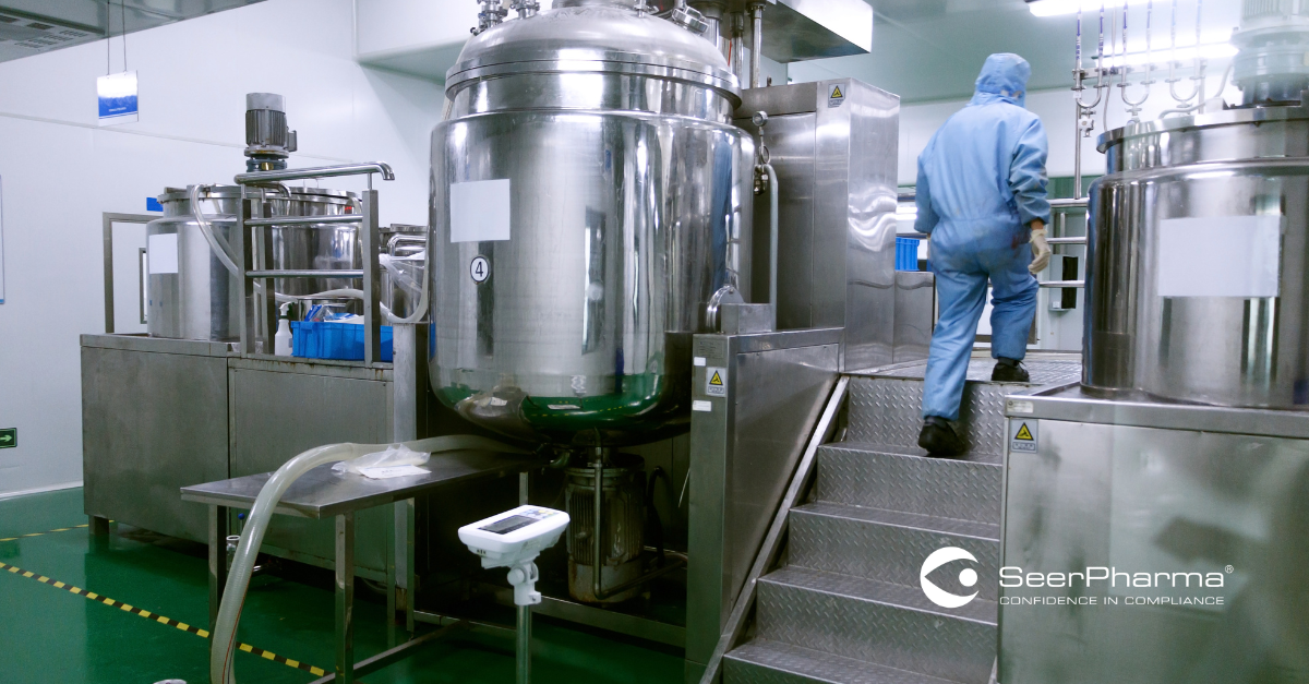 GMP Technician checking manufacturing process