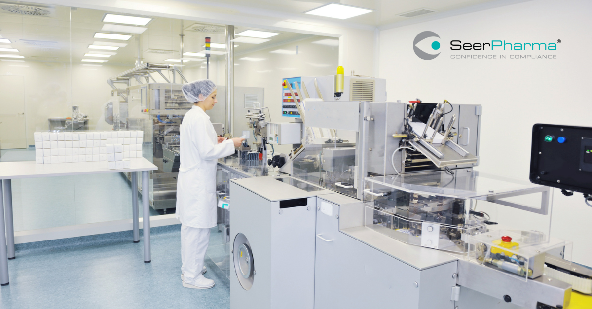 GMP-operator-working-on-packaging-line-at-a-distance