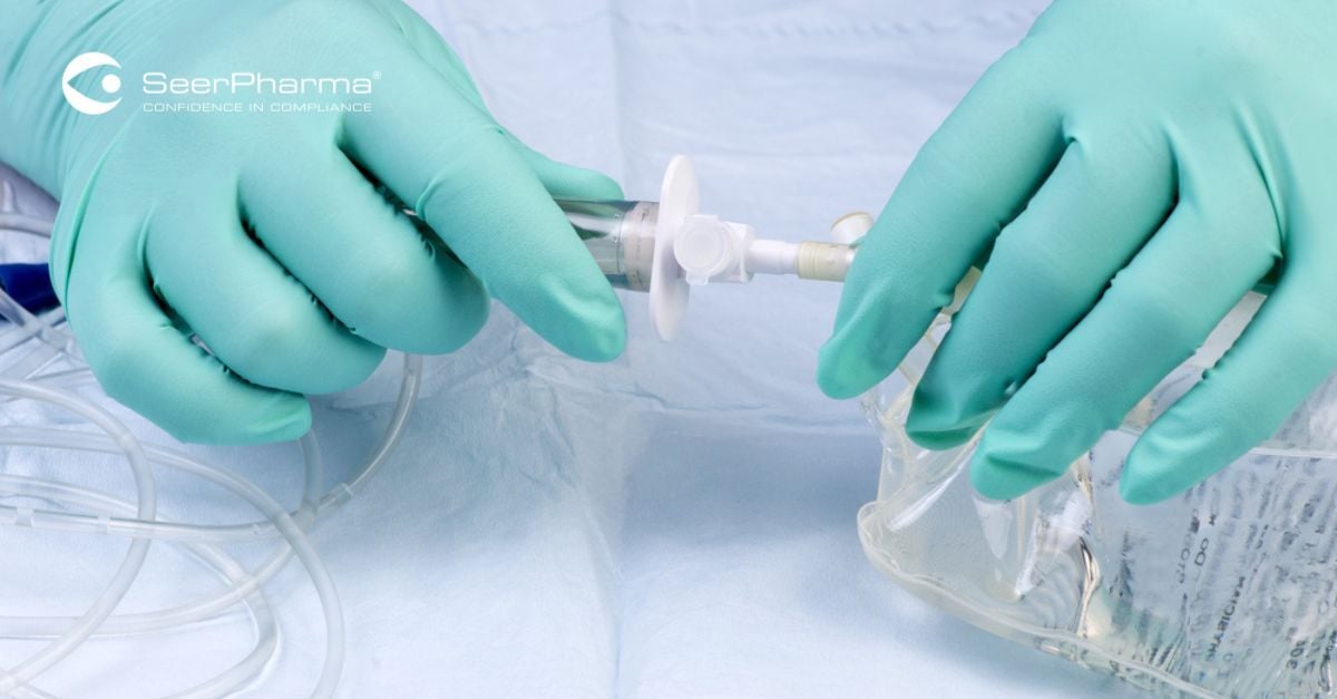 Gloved-hands-connecting-IV-line-and-bag
