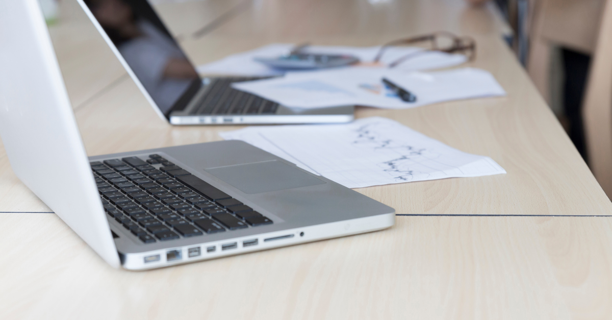 Laptop computers and documents representing computer system validation (CSV)