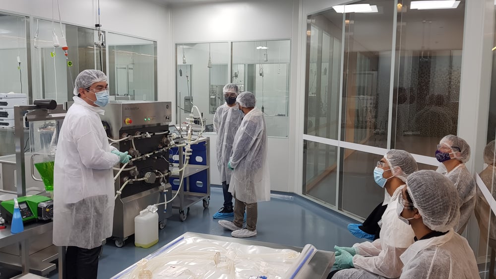 Gowned Students in Biologics Innovation Facility (BIF) as part of the Master of GMP Training at UTS